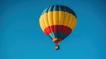 Fototapeta premium Colorful Hot Air Balloon Soaring in a Vivid Blue Sky