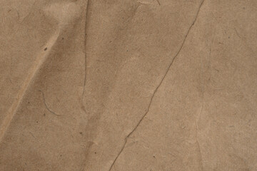 Grunge vintage old paper background. Brown crumpled paper texture.