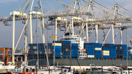 Container ship in bustling harbor with cranes, global trade, shipping logistics, maritime industry...