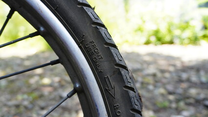 Obraz premium Close-up of a Motorcycle Tire with Brand and Model Engraving
