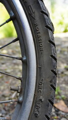 Close-up of a Motorcycle Tire with Brand and Model Engraving