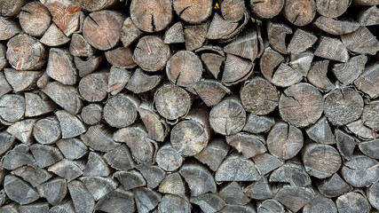 Stacked firewood logs create rustic texture, countryside warmth, cozy autumn, eco-friendly...