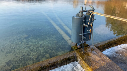 Water filtration system in a clear lake, environmental conservation, clean water technology  Bled,...