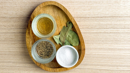 Herbs and condiments on wooden platter, culinary spices for gourmet cooking, seasoning mix, kitchen essentials