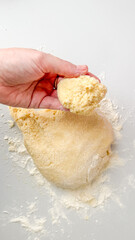 A hand kneading fresh dough, perfect for homemade bread baking, culinary preparation, holiday baking traditions
