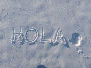 The word hola carved in fresh snow © FranciscoJavier