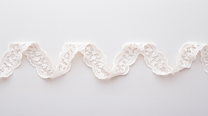 Delicate White Lace Trim: A close-up shot of a flowing white lace trim, showcasing its intricate details and elegant design.