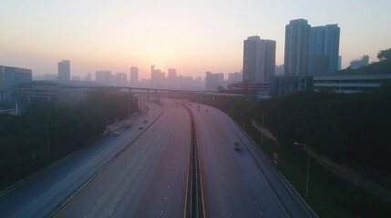 Fototapeta premium A serene image of an empty expressway during early morning hours, with soft, diffused light and minimal traffic, capturing the calm before the day begins.