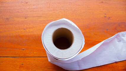 White Tissue Roll on Wooden Table – Minimalist Everyday Object