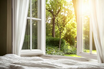 Fototapeta premium An open window with white curtains gently fluttering, letting in warm sunlight and a view of a lush green garden