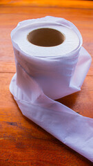 White Tissue Roll on Wooden Table – Minimalist Everyday Object