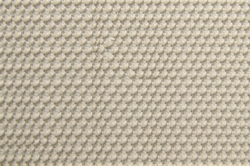 A fabric sample with a textured, chenille pattern, emphasizing its plush texture. creativity hobby and handicrafts, diy, background for design.