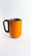 an orange cup whose paint has started to peel off, isolated on white