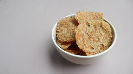 Keripik Tempe or Tempe chips, a typical Indonesian food made from thinly sliced ​​tempeh and then fried using seasoned flour. It's salty and savory. Close up