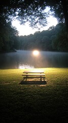 Obraz premium A serene lakeside view with a bench, reflecting sunlight through trees.