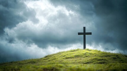 Dark Cross on Hilltop Under Stormy Clouds