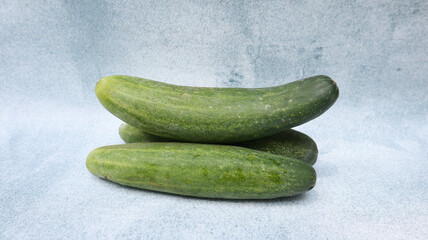 Fresh cucumber isolated on grey background