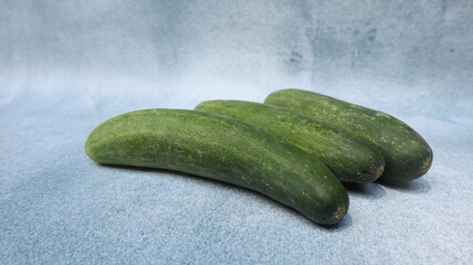 Fresh cucumber isolated on grey background