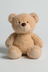 Obraz premium A soft, plush teddy bear sitting upright, designed for comfort and companionship.