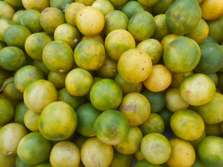Lemon is a citrus fruit known for its tangy flavor, refreshing aroma, and high vitamin C content. Lemon display in market place for sale, colorful picture for social media
