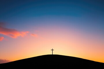 Silhouette of cross against vibrant sunset, symbolizing hope and