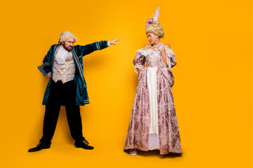 Elegant Costume Couple Depicting Nobility in a Carnival Celebration on Yellow Background