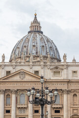 Close-Up of Iconic Cathedral Dome with Classical Architecture and Sculptures, St. Peter's Basilica,...