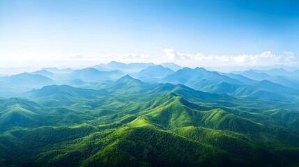 Fototapeta premium Vast Green Mountain Range Under a Bright Blue Sky