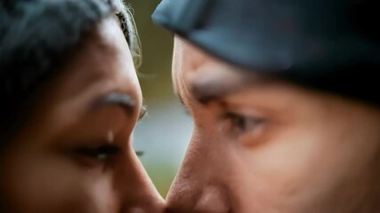 Intimate close-up of a couple, noses touching, eyes locked, a moment of deep connection and love