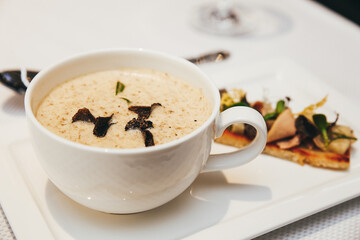 Fragrant French cream soup close-up. Restaurant serving