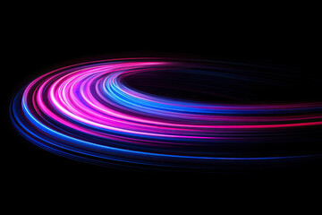 Abstract colorful light trails on black background
