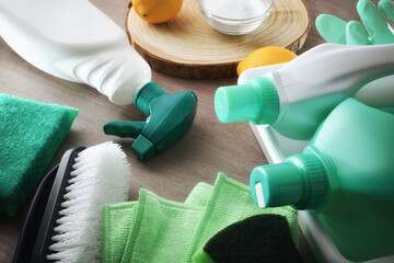 Cleaning products with natural ingredients on wooden table elevated view