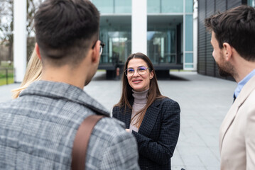 Professional occupation, office workers. Two business people meet before staff meeting and presentation in office building, to talk and discus plans and tactic of speech theme. Finance and economy.