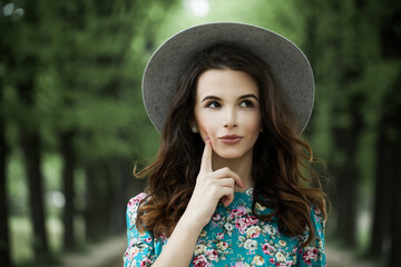 Brunette spring lady. Beautiful woman outdoors portrait