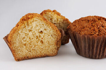 Cupcake in a paper cup on a white background.