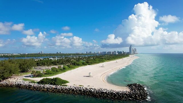Aerial of Haulover Inlet and Beach Park, with the Sunny Isles skyline in the distance.