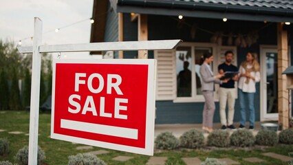 Camera focus on sign hanging in front of entrance to house. In blurred background people discussing...