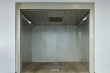 This industrial elevator interior is designed for efficient transport of goods and materials