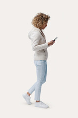Woman standing and checking her smartphone