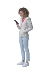 Woman standing and checking her smartphone