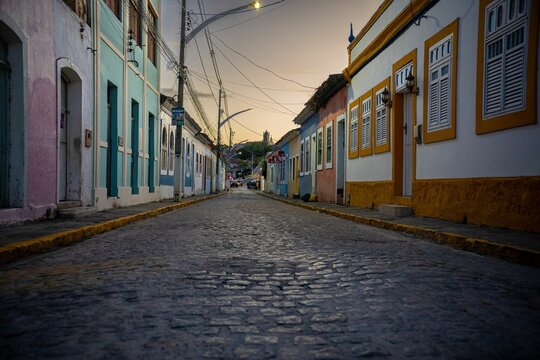 Fototapeta Colorful buildings line a street in Marechal Deodoro, Alagoas, Brazil.