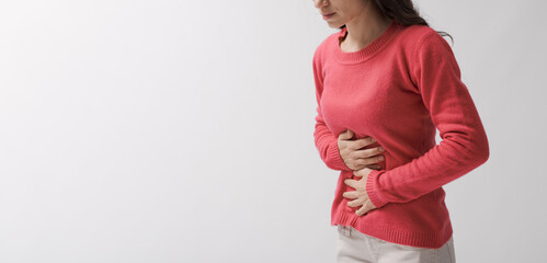 Young woman suffering from abdominal pain