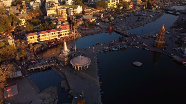 Nashik city Hindu pilgrimage temples, Panchavati ganga ghat on the banks of holy river Godavari in sunset evening, 2027 Kumbh Mela, Drone