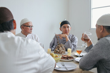 Portrait of Multi Generation Muslim Family Doing Conversation at Dining Room on Ramadan Moment