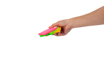 Paper stickers in hand. Hand holding a green sticker. Notes for the message on transparent background.