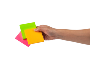 Paper stickers in hand. Hand holding a green sticker. Notes for the message on transparent background.