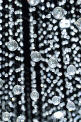 Crystal balls suspended from ropes.interior decoration for luxury concepts. Shiny sparkling background
