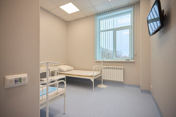 A Hospital Bed located within a Medical Facility designed for patient comfort and care
