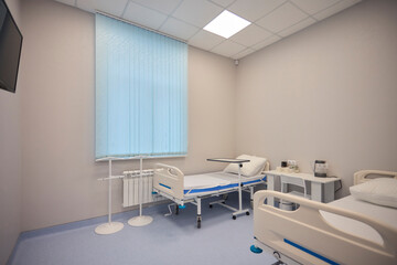 A Hospital Bed located within a Medical Facility designed for patient comfort and care