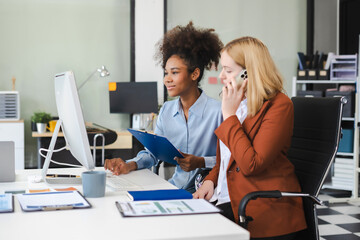 Diverse professionals collaborate on project analysis with financial graphs.
